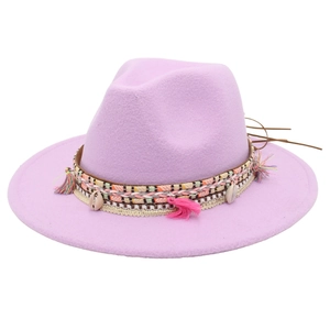 Detail of bohemian lavender felt hat with ethnic woven band, pink tassels and shell accents