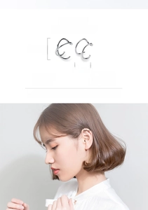 Macro detail of S925 sterling silver double layer ear cuffs with sizing and ear placement