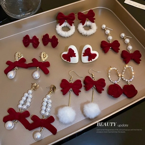 Red flocked bow and pearl earrings set for women featuring festive winter designs