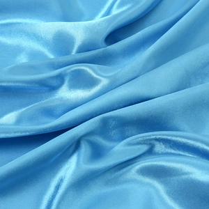 Sky blue satin square scarf with a smooth silk-like finish and elegant drape texture