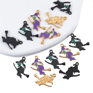 Macro detail of alloy Halloween witch pendants with purple and black enamel drip finish