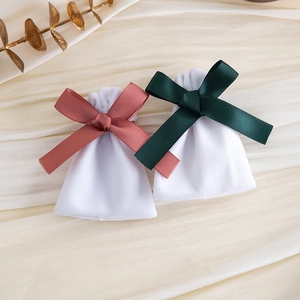 White velvet jewelry drawstring pouches with pink and dark green silk ribbons