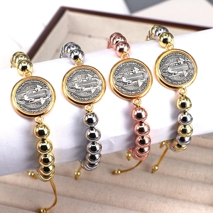 Adjustable St. Benedict beaded bracelets in gold, silver, rose gold, and mixed tri-color