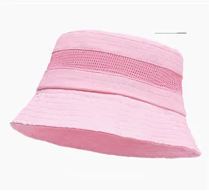 Detail of pink summer bucket hat showing breathable mesh band and stitched brim
