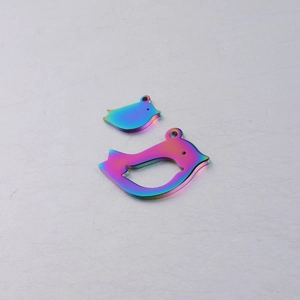 Macro view of rainbow electroplated stainless steel bird charms in a two-piece set