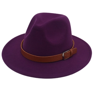 Close-up of deep purple wool felt fedora hat featuring a brown leather band and silver buckle