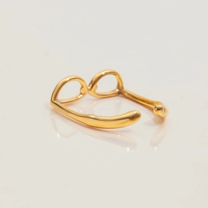 Detailed shot of 18K gold-plated stainless steel open ring with organic double-loop design