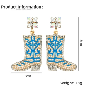 Detail view of blue rhinestone cowboy boot earrings with 5cm size and 18g weight measurements