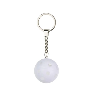 Translucent white pickleball keychain with silver metal ring on white background