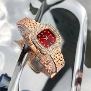 Elegant rose gold square watch with a vibrant red dial and sparkling diamond bezel for women