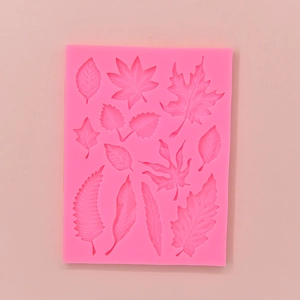 Bright pink leaf shaped silicone mold for DIY cake decorating with detailed textures
