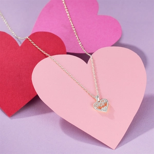 Close-up of S925 sterling silver heart pendant with MOM engraving and sparkling zircon