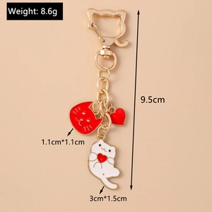 Detailed view of cat paw keychain with size annotations and enamel pendant charms