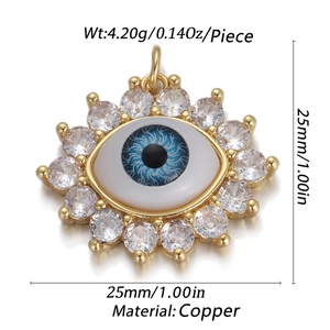 Detail view of Evil Eye pendant in gold copper with white cubic zirconia and blue center