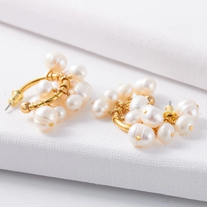 Classic white freshwater pearl earrings with gold wire-wrapped circular C-shape design
