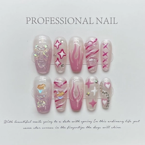 Pink and white handmade press-on nails with 3D bows, bear charms, and rhinestone accents