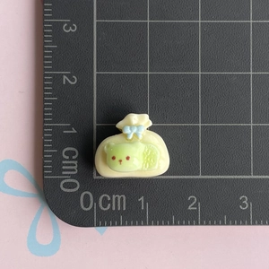 Miniature cream lucky bag resin charm with blue bow and green bear detail for DIY crafts