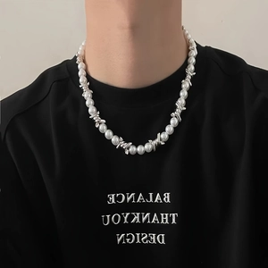 Men's retro hip-hop cross pendant necklace with pearls and rhinestones on black shirt