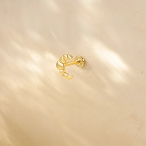 Detail of S925 hallmark on gold croissant stud earring with flat back screw
