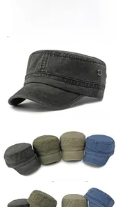 Detail of washed cotton flat caps showing breathable metal eyelets and vintage textures