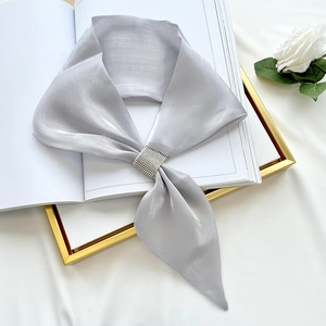 Elegant silver satin neck scarf with rhinestone buckle for women on white background