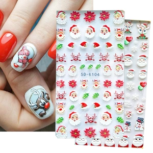 5D Christmas embossed nail stickers featuring Santa and snowflake designs for holiday manicure