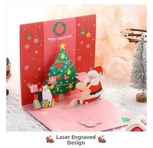 Detailed laser-cut Christmas 3D pop-up card with Santa, penguin and festive tree