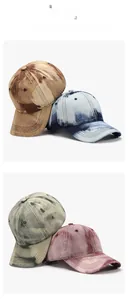 Detail of distressed baseball caps in four vintage colors with washed cotton texture