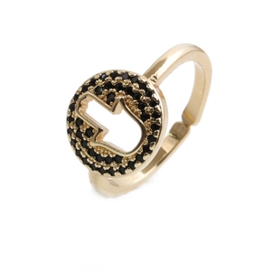 Golden Hamsa hand ring with black pave zircon stones in a minimalist open design