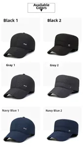 Close-up of quilted winter baseball caps and cadet hats in black, grey, and navy colors