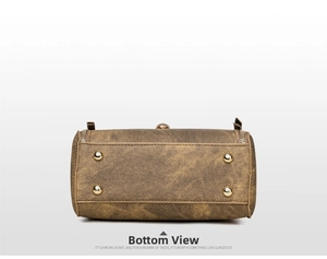 Detail view of the vintage handbag base featuring four gold protective metal studs