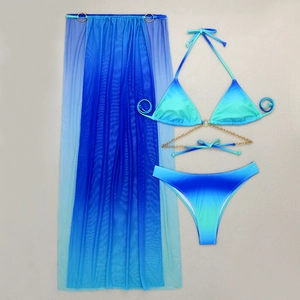 Detail of blue gradient bikini with gold chains and matching mesh long skirt