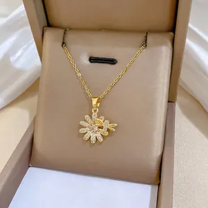 Golden titanium steel necklace with sparkling crystal flower pendant in a gift box