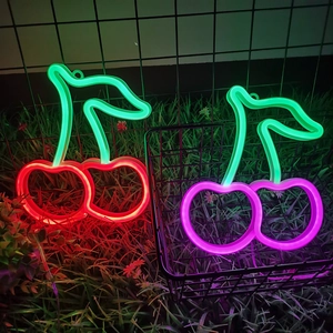 Neon cherry shaped LED lights in red, pink and green for wall decoration and ambiance