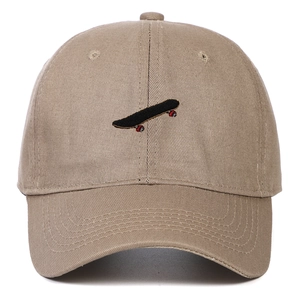 Detailed embroidery of a small skateboard on a premium khaki twill cotton baseball cap