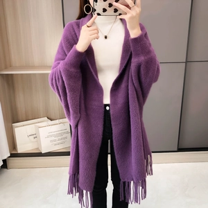 Detail view of purple faux mink fur cardigan featuring soft texture and long tassel hem