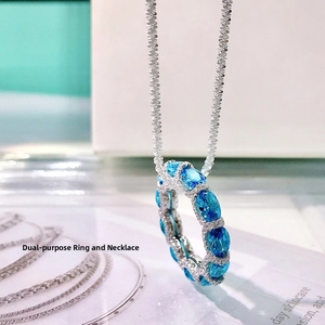 Dual-use silver ring necklace featuring oval blue gemstones and sparkling crystals