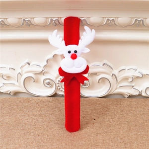 Detail of red Christmas reindeer slap bracelet made of soft felt with white antlers