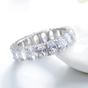 Luxurious S925 silver eternity ring featuring brilliant oval cut clear gemstones