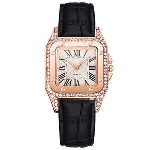 Square rose gold fashion watch with Roman numerals and rhinestone bezel on black strap