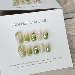 Green gradient press-on nails with 3D lemon slices and sparkling crystal gems
