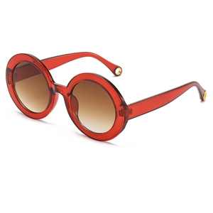 Fashionable round oversized red sunglasses with gradient brown lenses and gold details