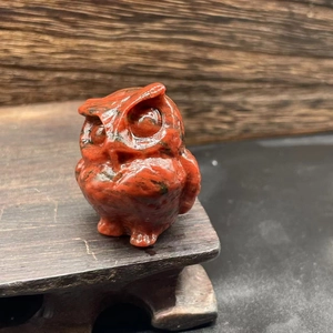 3.5cm natural stone owl figurine carved in reddish-brown and black on dark wooden base
