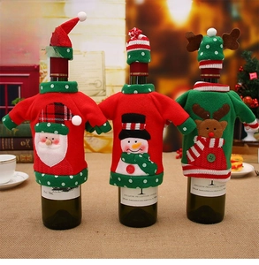 Close-up of knit Christmas wine bottle covers with Santa, snowman, and reindeer designs
