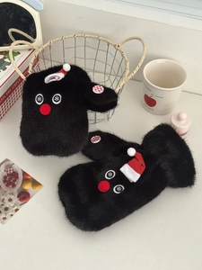 Detail of plush black mittens with cute red hat snowman design and decorative buttons