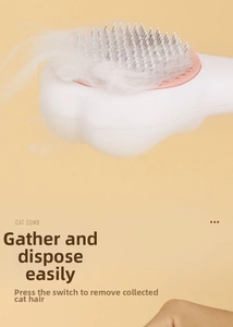 Gros plan sur la brosse autonettoyante rose pour poils d'animaux et de chats