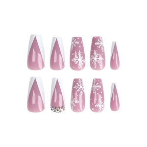Christmas press-on nails with pink French V-tips, white snowflakes and rhinestones