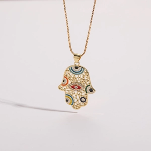 Detailed close-up of 14K gold plated Hamsa pendant with colorful enamel eye patterns