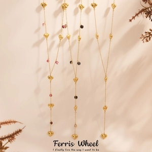 Elegant gold heart pendant necklace with natural agate beads and long tassels