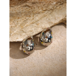 Chic silver water drop earrings with colorful rhinestones on a natural rock background